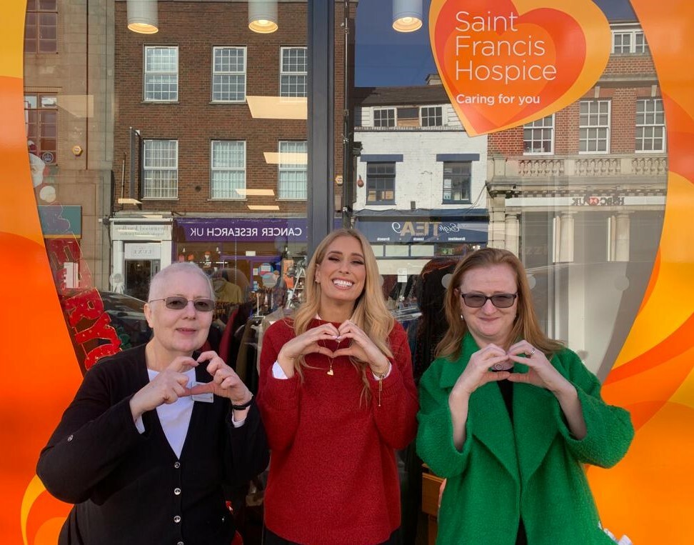 Susam Kemp, Stacey Solomon and Anita McCarthy heart hands outside brentwood store