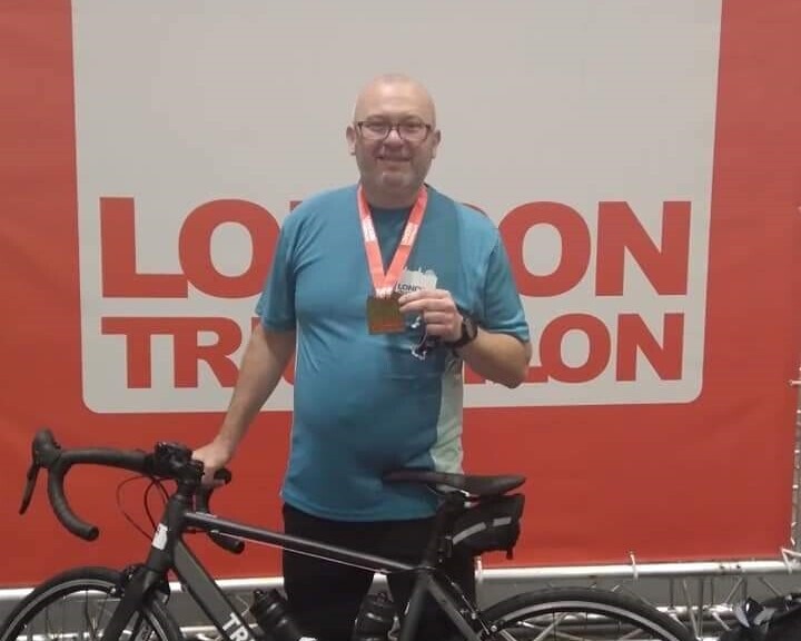 Dean Baker with his medal (cropped)