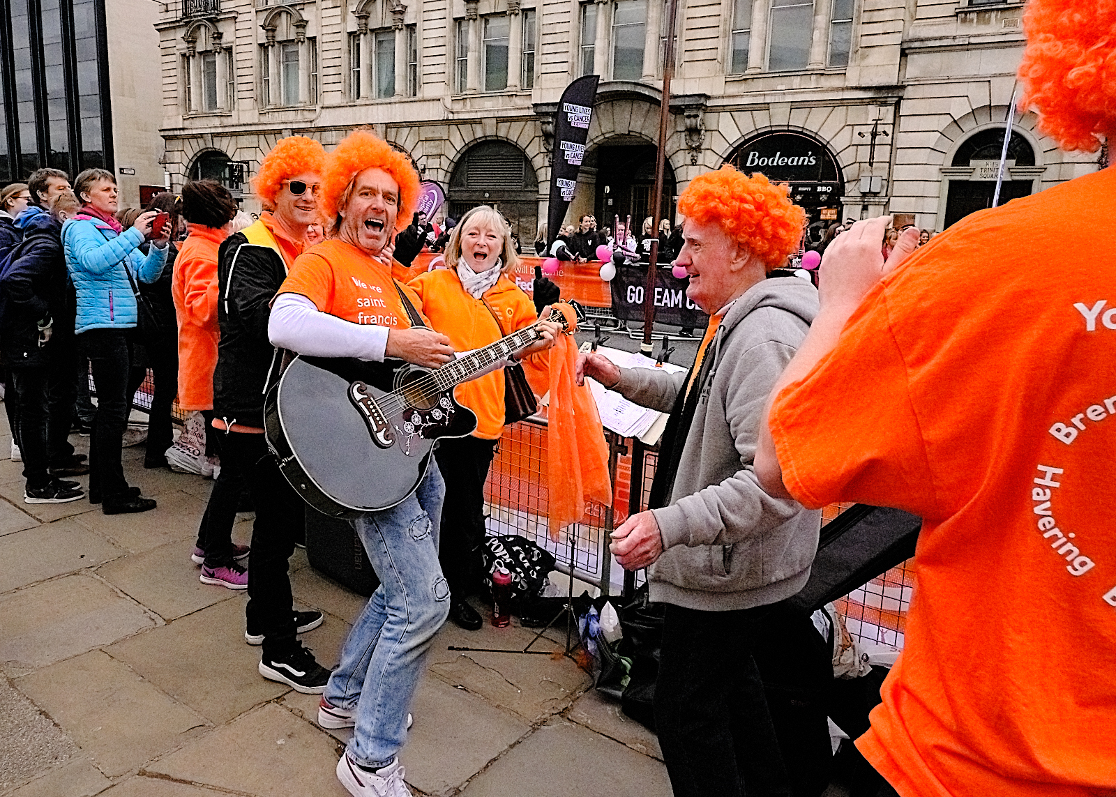 Cheer squad with volunteer Skip Atkins entertaining runners and spectators