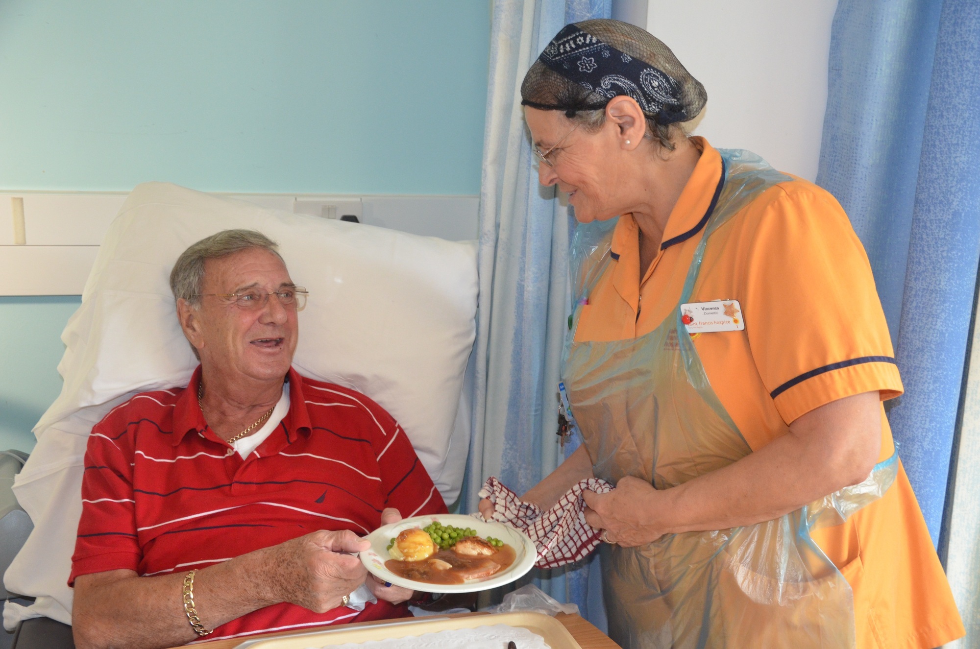 Patient being served a meal pre-lockdown