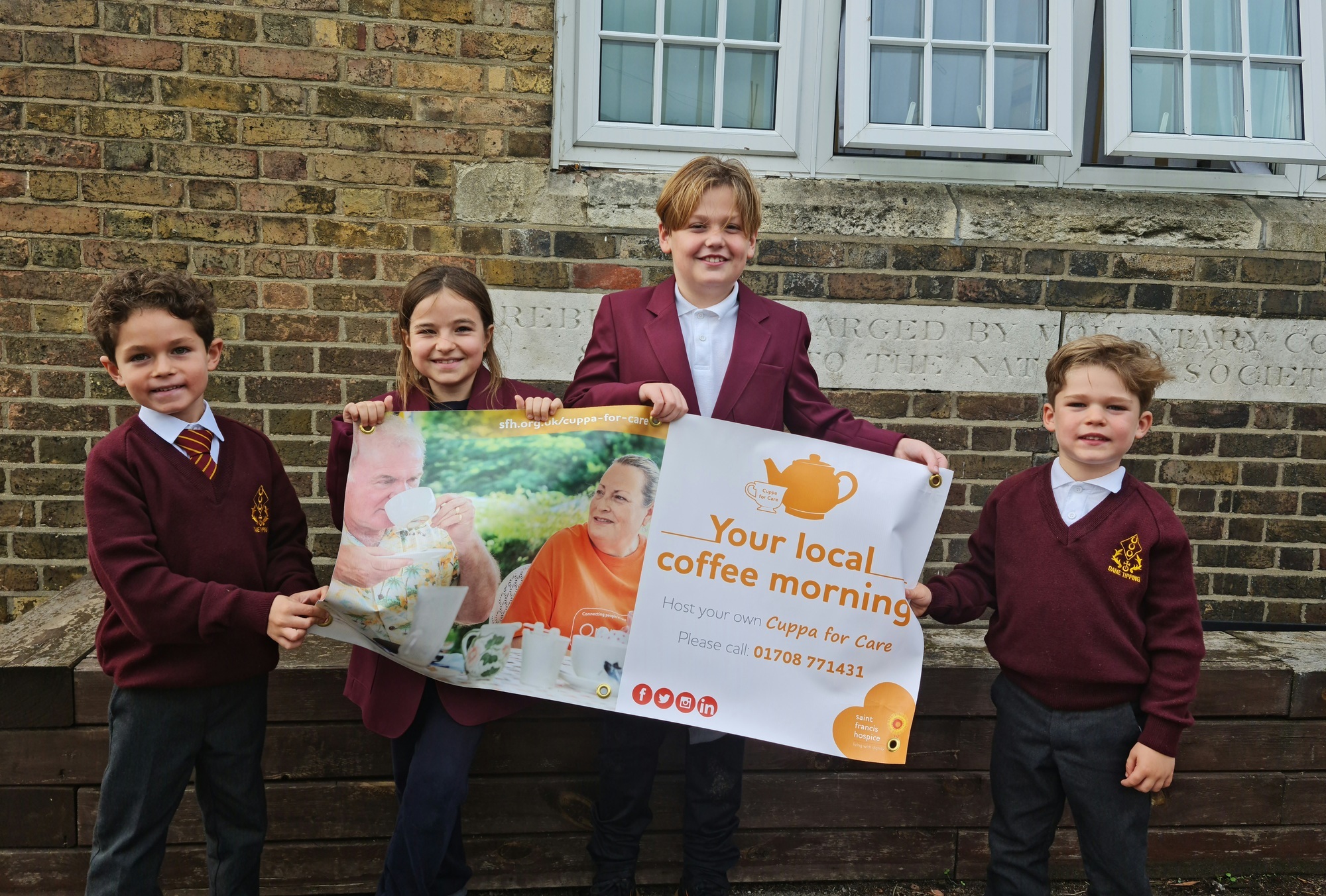 Dame Tipping students with Cuppa for Care banner