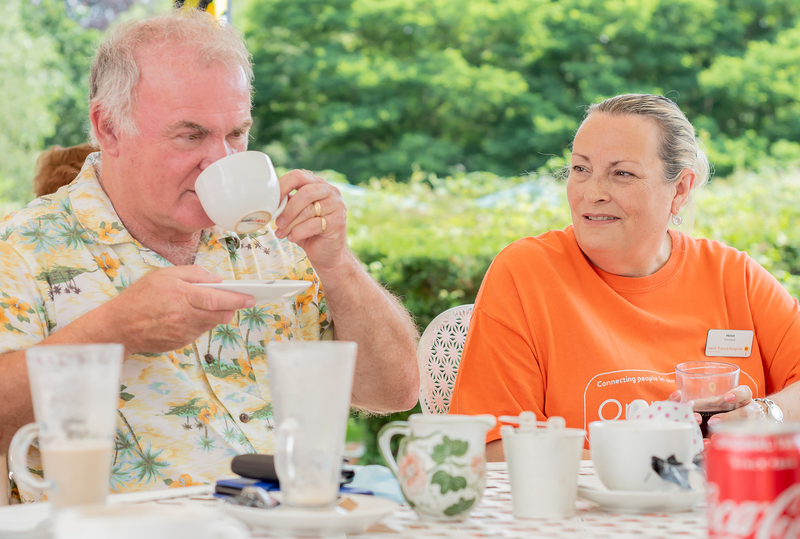 Enjoying a chat and a cuppa (cropped)