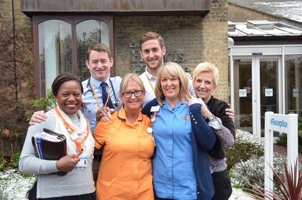 We are Saint Francis Hospice - team picture outside saint francis hospice