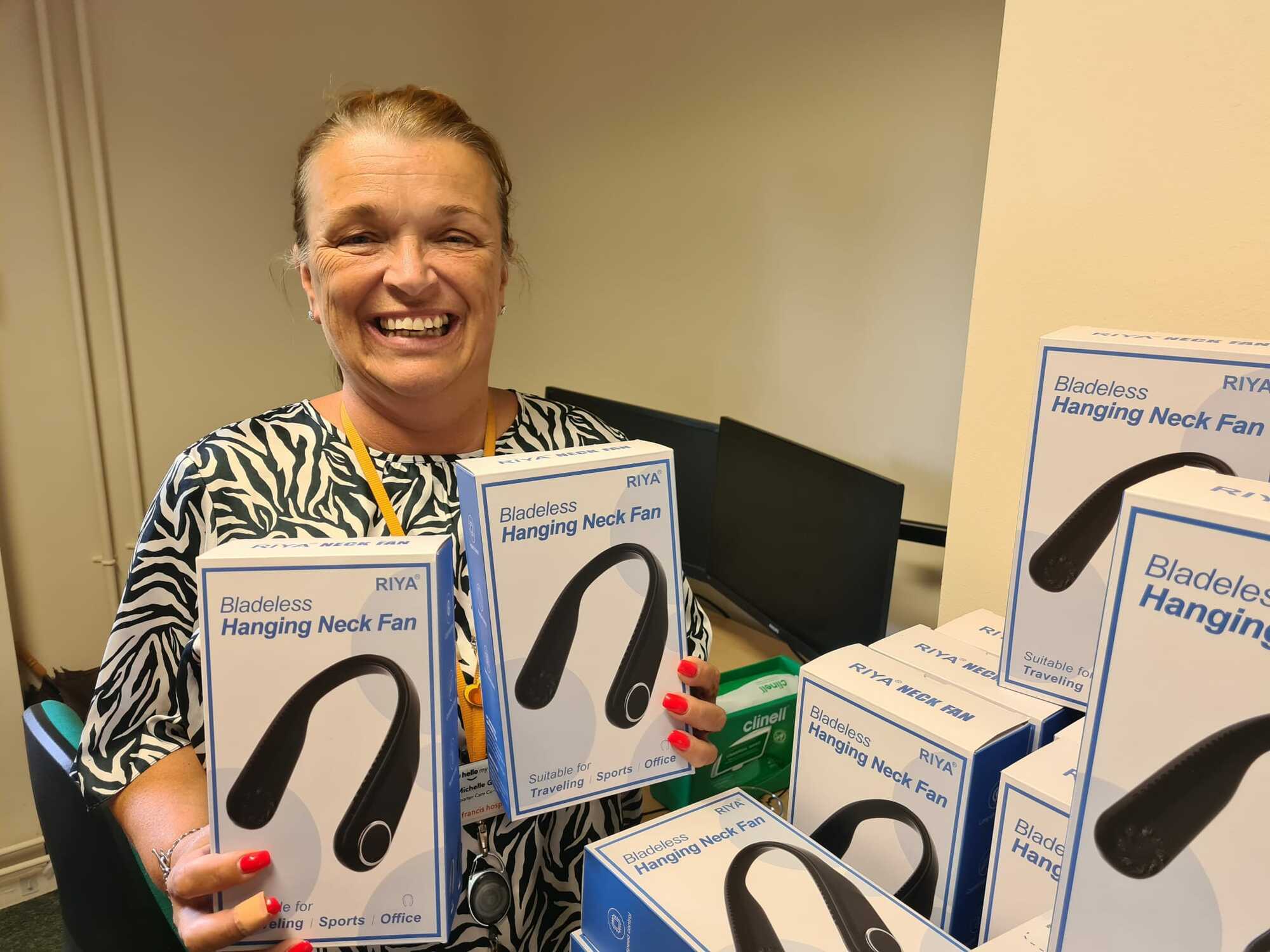 Michelle Gower with donation of fans for patients