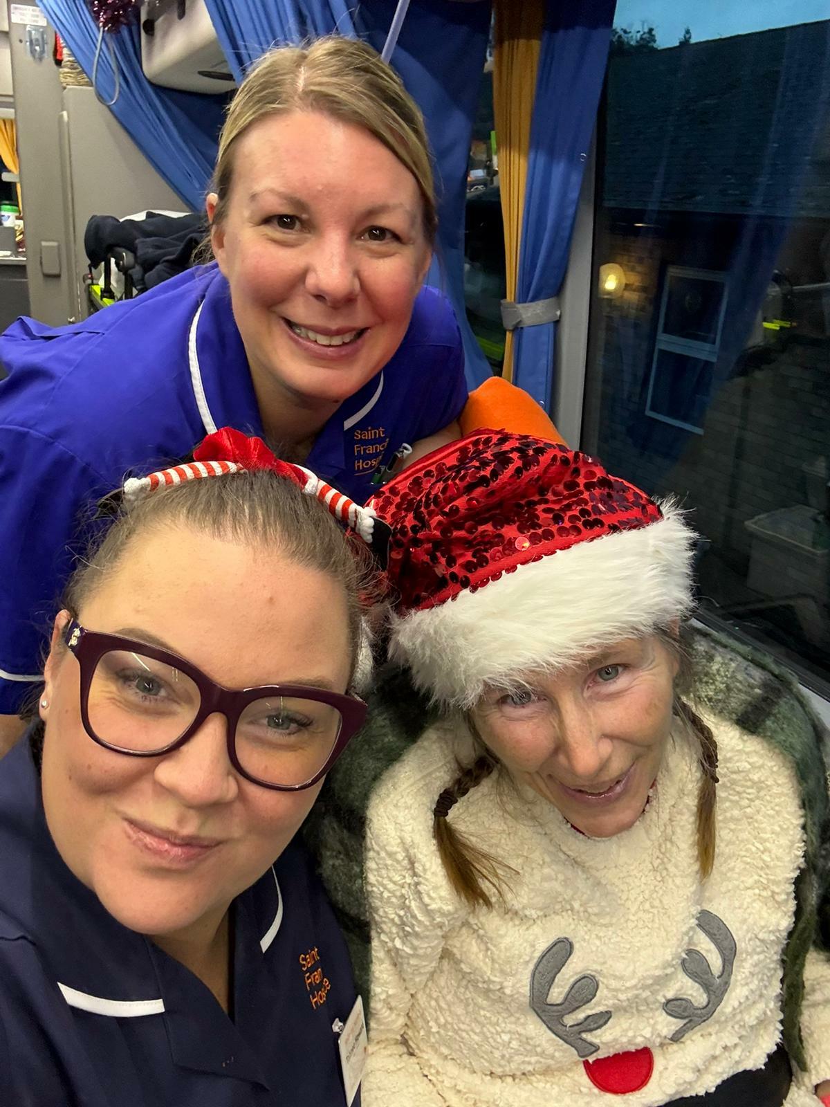Leanne (Christmas jumper) who is under hospice care with nursing team Tahnee and Lisa