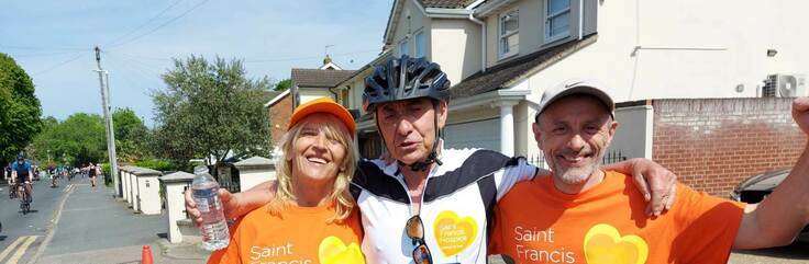 Jenny with volunteer and cyclist at Ride London Essex (cropped)