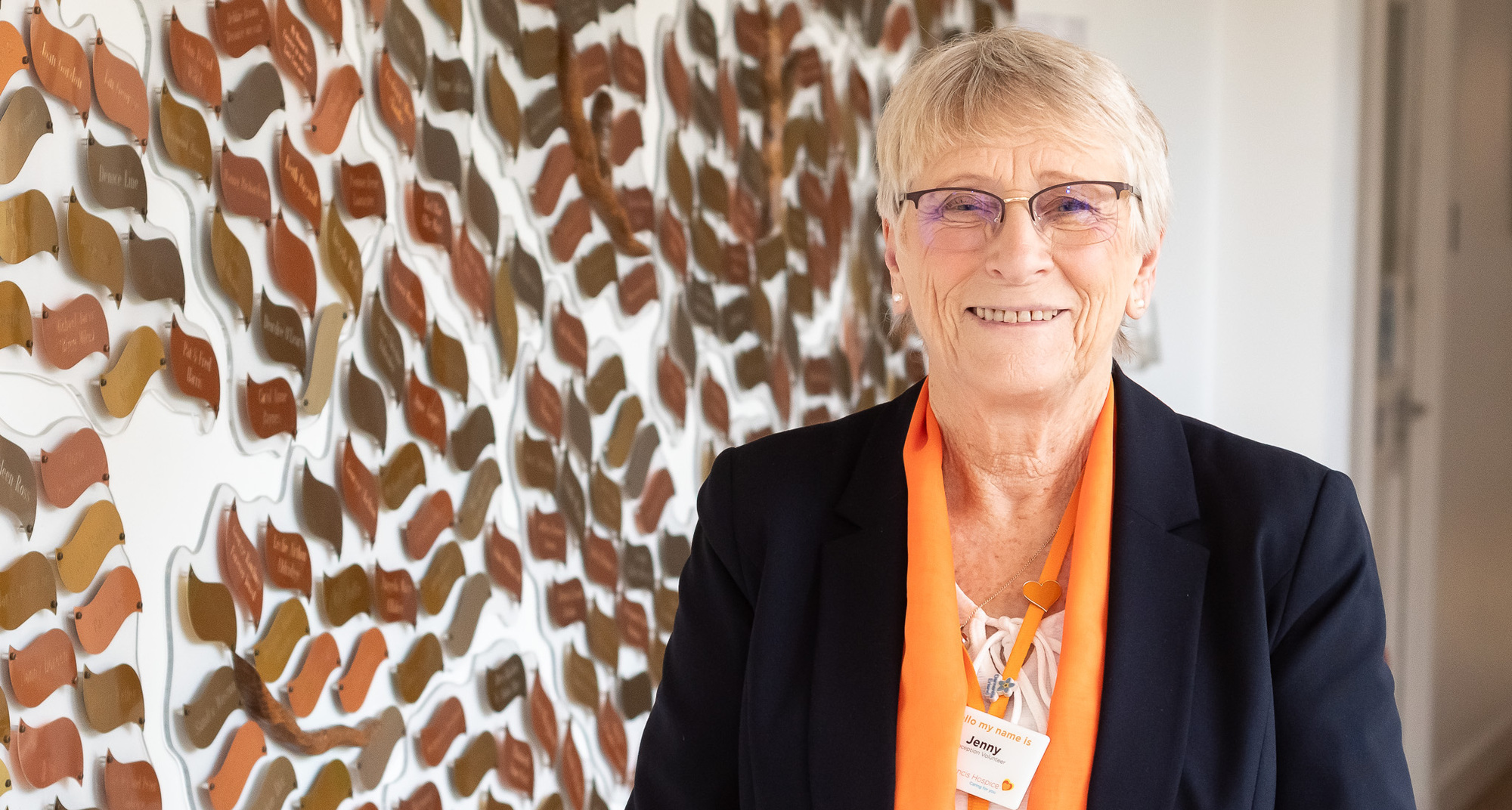 Volunteer Jenny Hodgson in front of the memory tree (cropped)