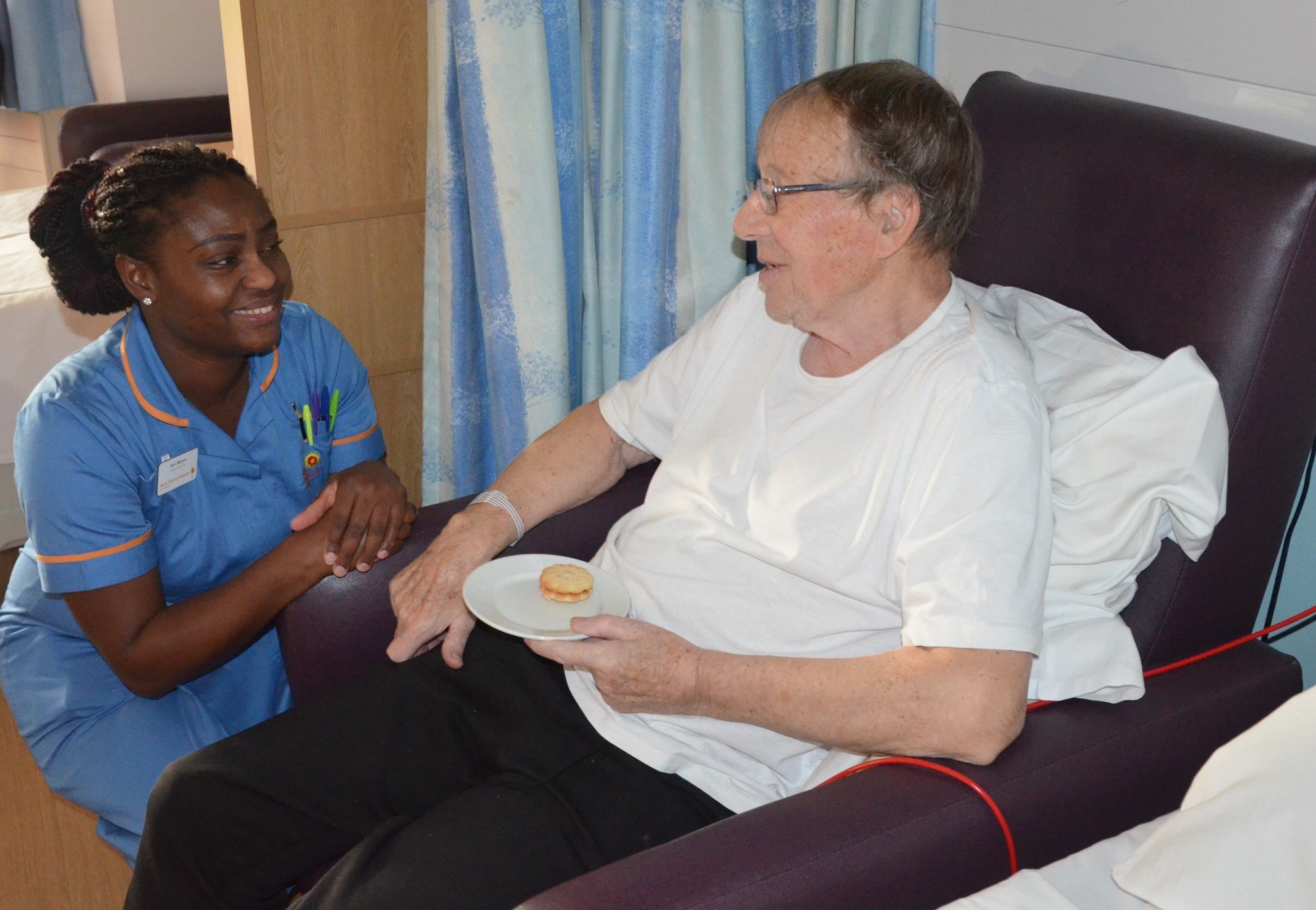 Ward Nurse Sam with a patient 