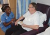 Ward Nurse Sam with a patient
