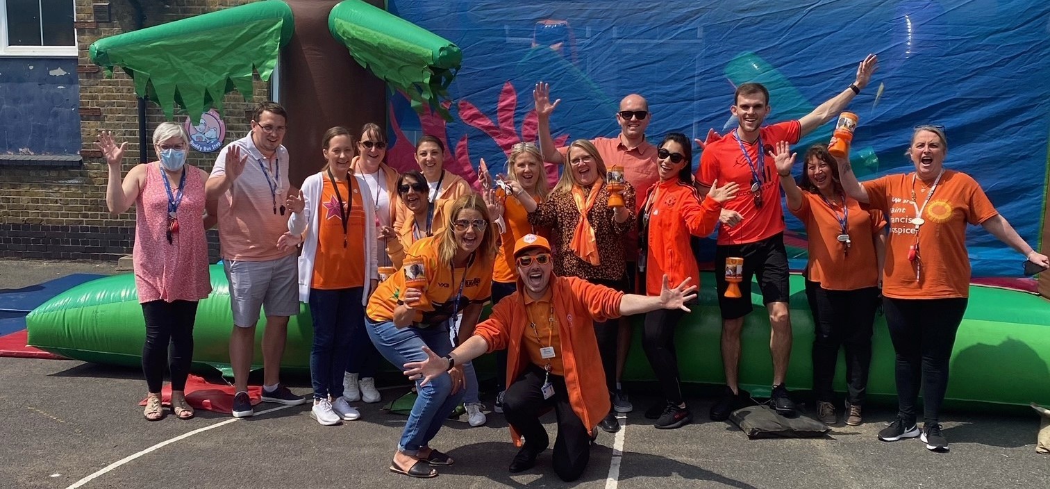 Teachers and staff at Crowlands Primary School Go Orange Day (cropped)