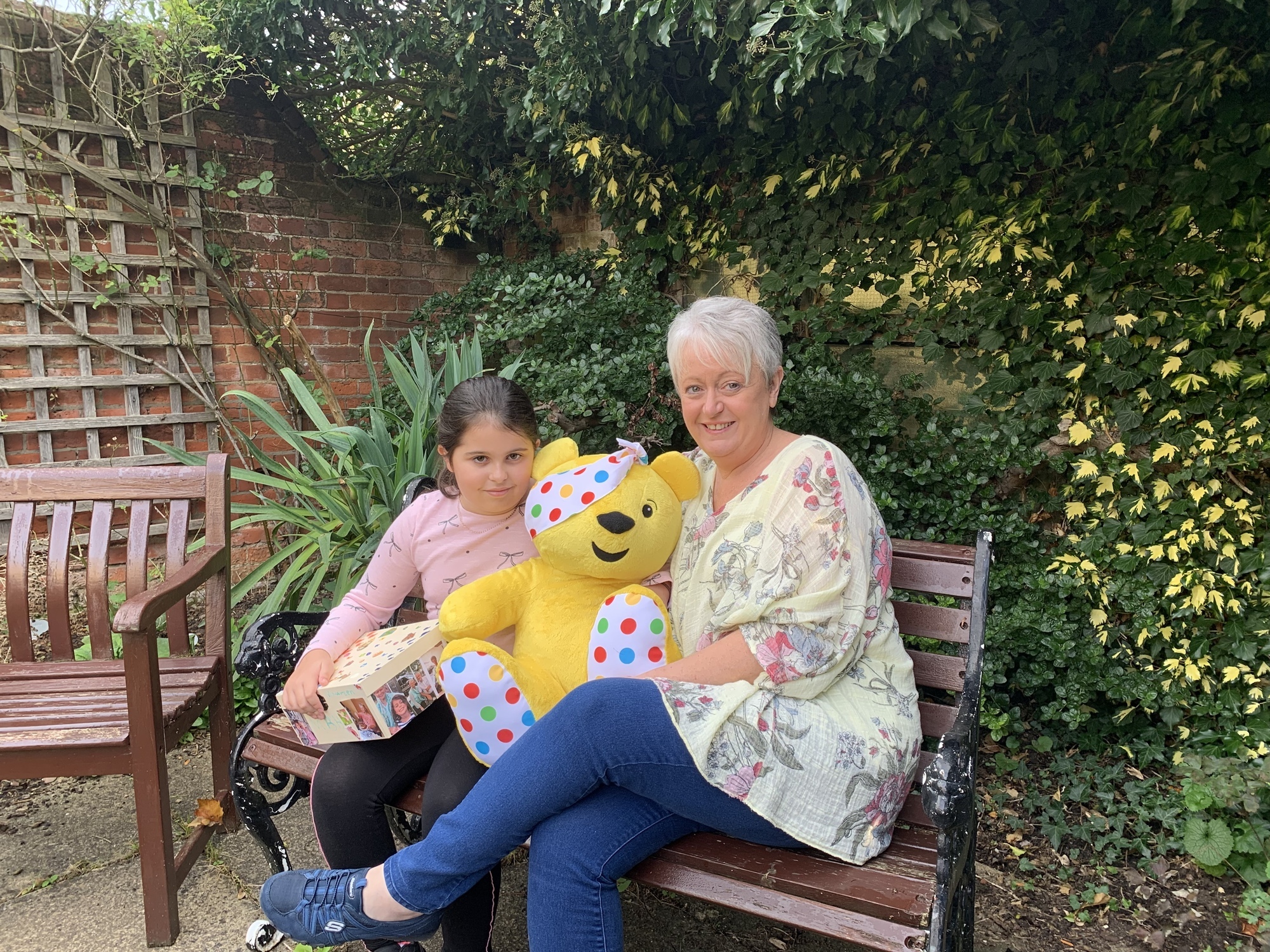Sophia with her mum and Pudsey