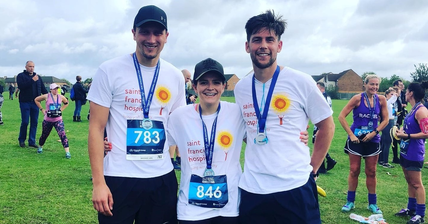 Joanne and Matthew with Ross just after crossing the finish line crop