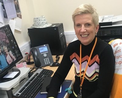 Sue at her desk (cropped)