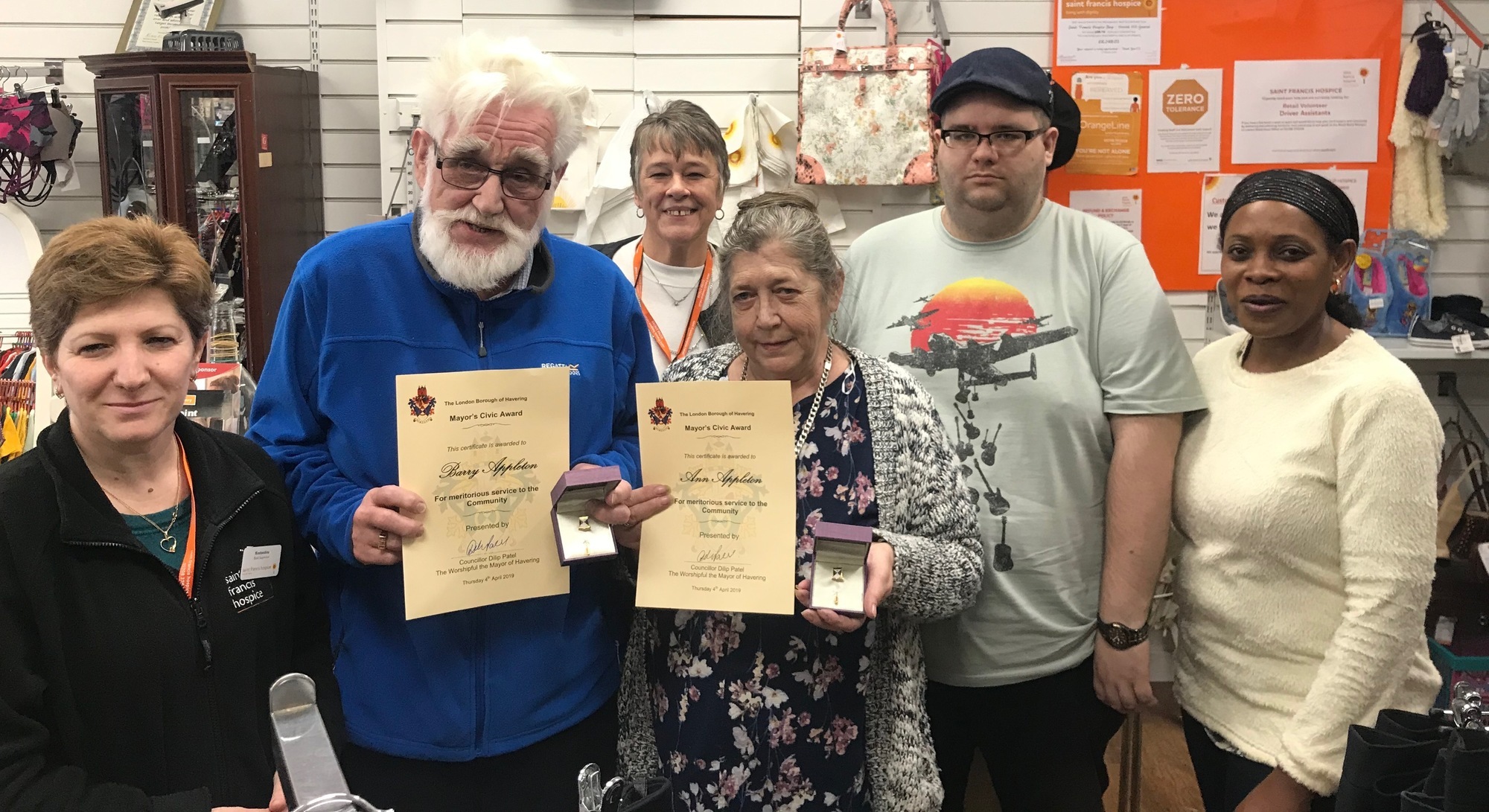 Barry and Ann Appleton proudly show off their Civic Awards with store Manager Mary Banks and fellow volunteers WEB
