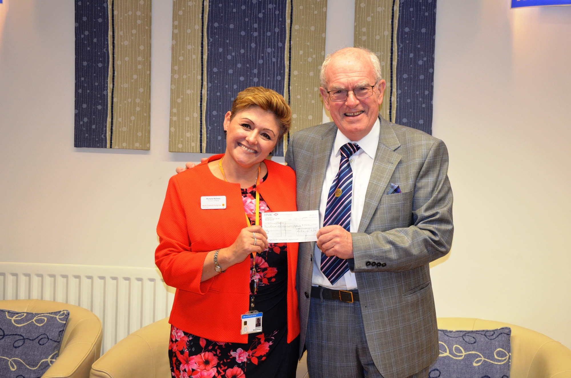 Michelle Nicholls receiving a cheque donation from Hospice Trustee Neville A. Brown